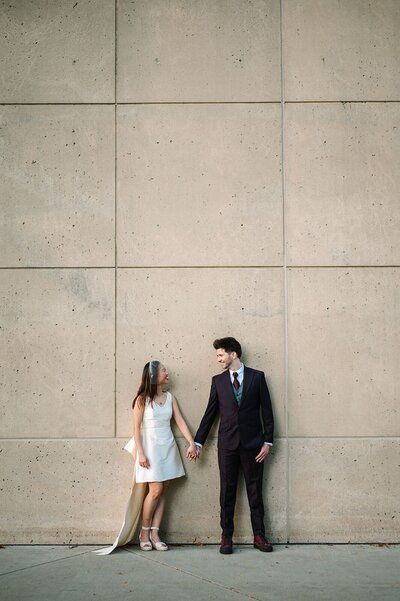 Bride and Groom posing Downtown Indianapolos for wedding photos