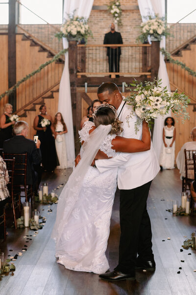 A bride and groom have a dance outside of their churh