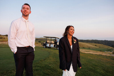 bride and groom on the golf course during sunset