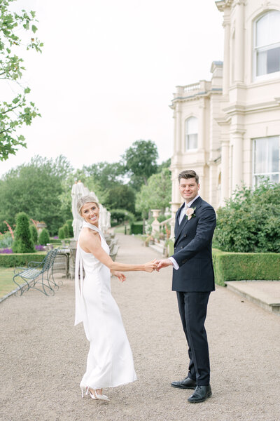 Bride and Groom embracing and looking at each other, The image is in colour and is edited in a light and airy style.