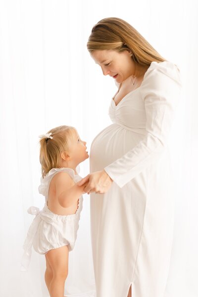pregnant woman and child taken by maternity photographer boston ma​