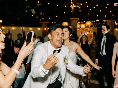 dancing groom having fun at wedding reception