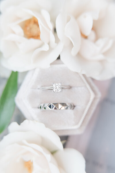 Calyx Floral Designs Flowers around Bride and Grooms Rings