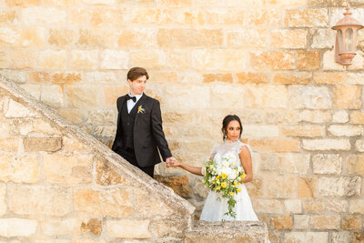 WEDDING PORTRAITS IN FRONT OF STONE WALL