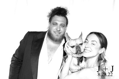 black and white portrait of couple with their dog