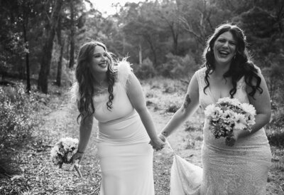 Brides laughing during first look before The Farm wedding