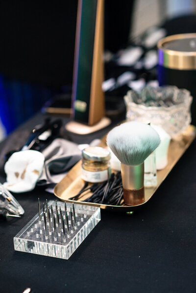 Close-up of custom engraving tools used to personalize sunglasses at a corporate conference at the Dubois Center in Charlotte, NC, photographed by DeLong Photography, a Charlotte event photographer.