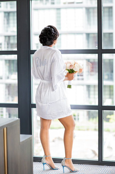 lady looking out hotel window