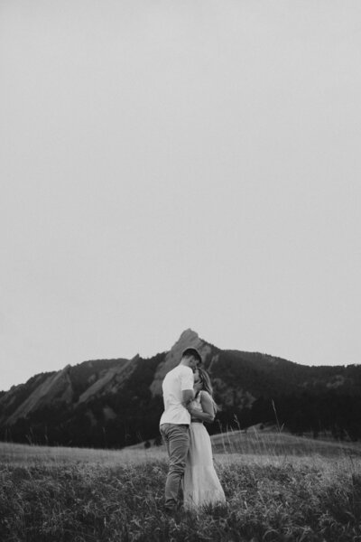 Engagement photos in Boulder, Colorado with a mountain background..