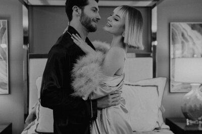 Documentary candid black and white photo of bride and groom dancing in a bedroom in Las Vegas