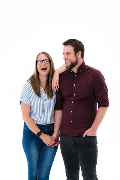 sam and grace laugh and hold hands