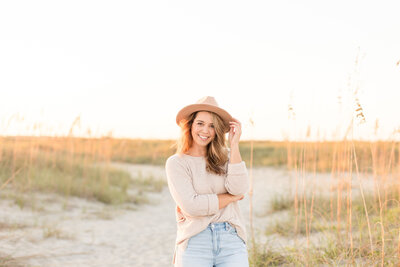 Woman with hat on the beach