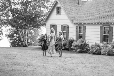 Mom and daughters walking away | Family Session