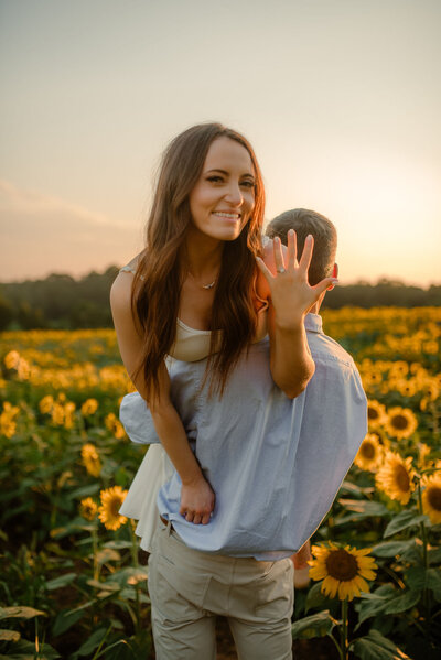 Photo of bride and groom in front of the sun flower field
