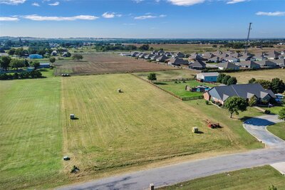 View of secluded, tree-lined lot ready for building