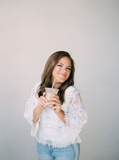 Claire Hodges smiling with a coffee cup