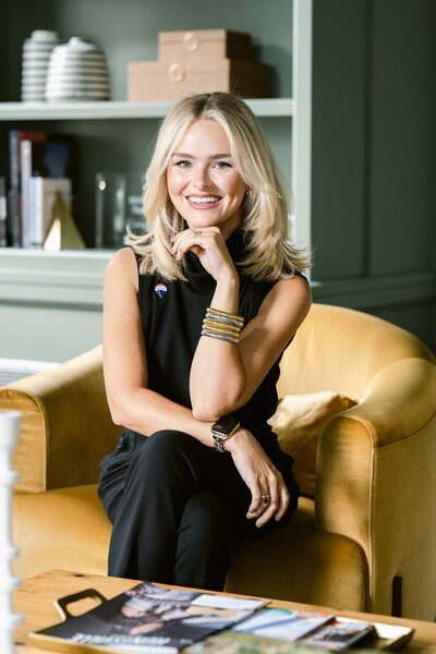 woman headshot on yellow chair