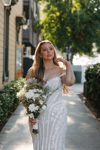 downtown san diego wedding, bride touching hair 