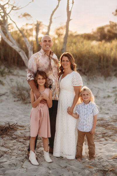 Mother hugs her son during Family Pictures on Folly Beach.