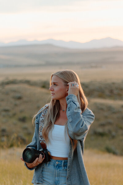 The photographer behind wild summit photo posing for the camera.