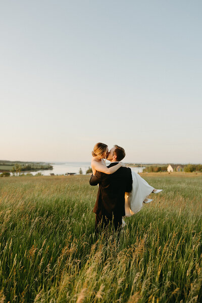 bride and groom in field at pei wedding