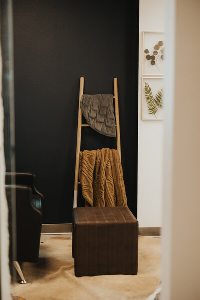 A shot of the studio — natural wood textures, moody greens, and soft light