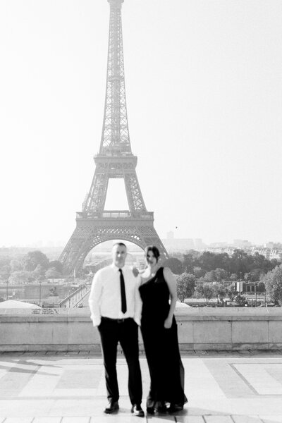 couple in front of eiffel tower