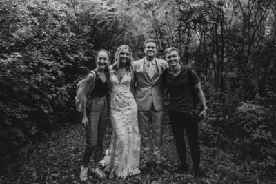 A photographer and videographer with a couple on their wedding day