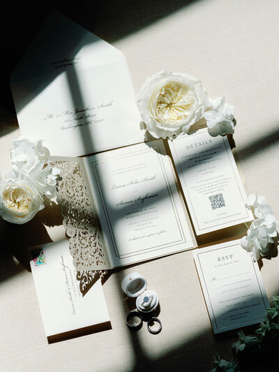 Photo of invitation suite with shadows from window
