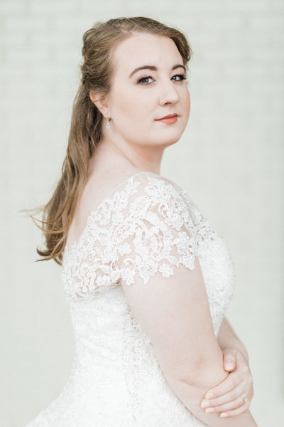 bride smiles for indoor bridal portrait