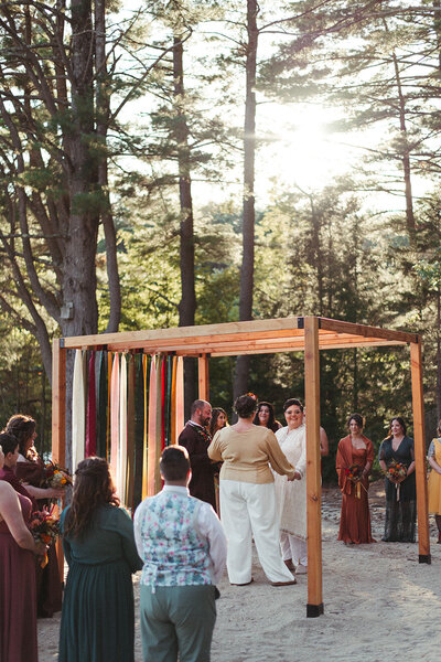 Couple standing together during ceremony, Unique Melody Events & Design - Wedding Ceremony