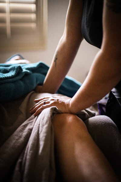 Healing Haven's massage therapist working on a clients knees.