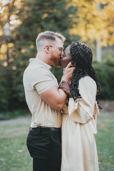 man and woman kissing