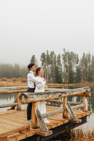 Boulder Wedding Photographer captures groom hugging bride