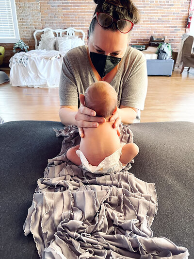 behind the scenes at a newborn photography session in shelby township mi studio