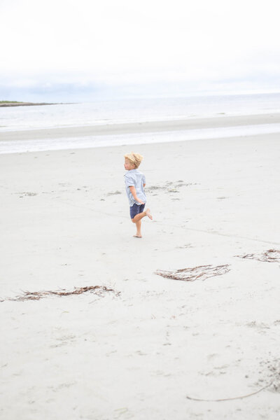Kid running on the beach | Family Photos