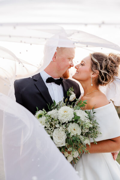 Couple back to back on wedding day