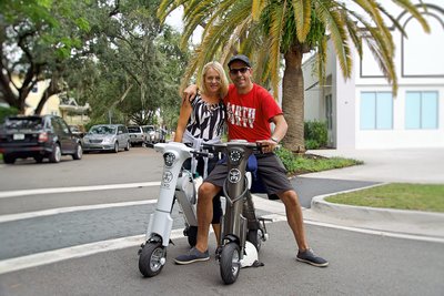 Honeymooners out for Sunday ride on Grey & White Go-bike M1