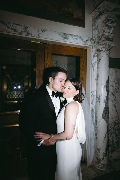 Elegant editorial wedding portrait of bride and groom in historic European-inspired venue by destination photographer Madison