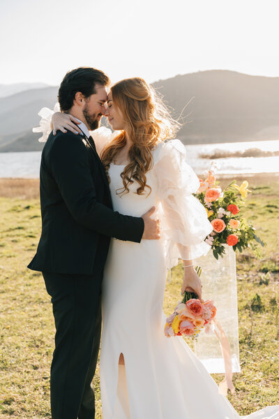 bride and groom facing each other with noses together in houston texas