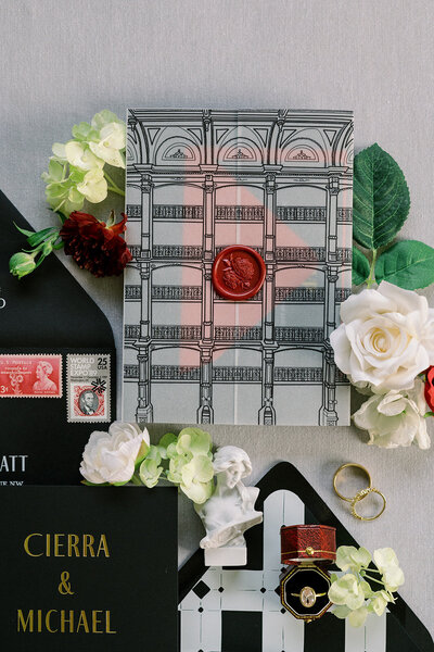 hand drawn venue illustration on vellum wrap sealed with rich red wax seal