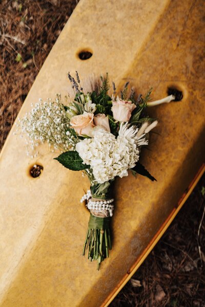 Future mom holding belly and looking out window