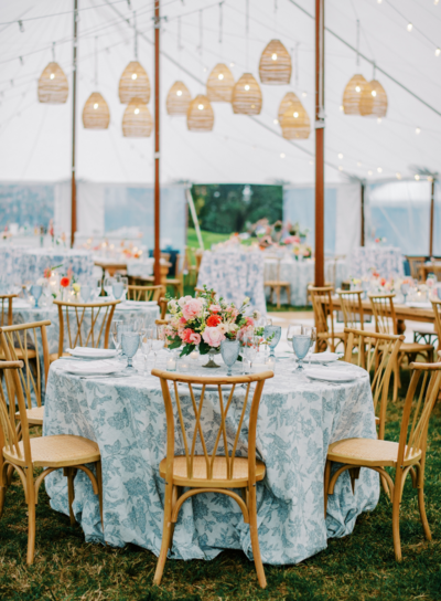 A view of a tented reception at Kirkland Manor with dusty blue and coral design