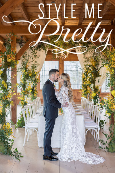 Outdoor wedding tablescape with fresh oysters, crystal glassware and a green & white floral arrangement
