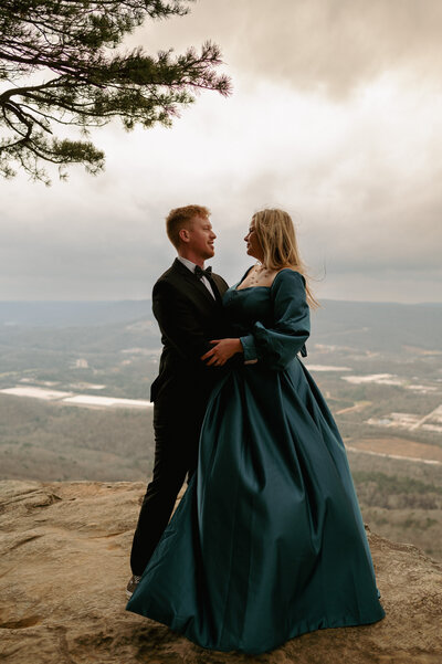 A couple poses on Sunset Rock on Lookout Mountain in Tennessee.
