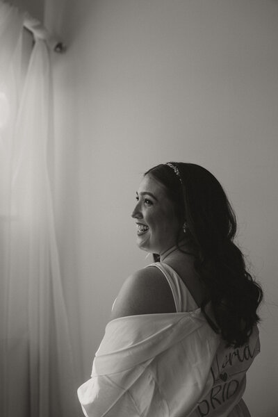 black and white photo of bride getting ready, bride getting ready robe