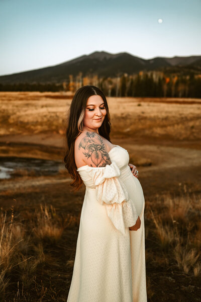 Mount Humpreys in flagstaff with woman in a maternity gown by annie bee photography.