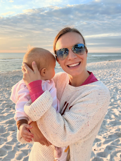 Allee Peterson_Founder of Type Won Coaching™ for T1D Moms_ Holding Daughter on a Beach