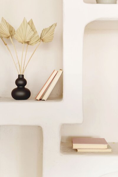 Intentional shelf styling that creates balance, warmth, and understated luxury