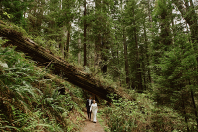Same-sex couple laughing with joy during their Big Sur adventure elopement